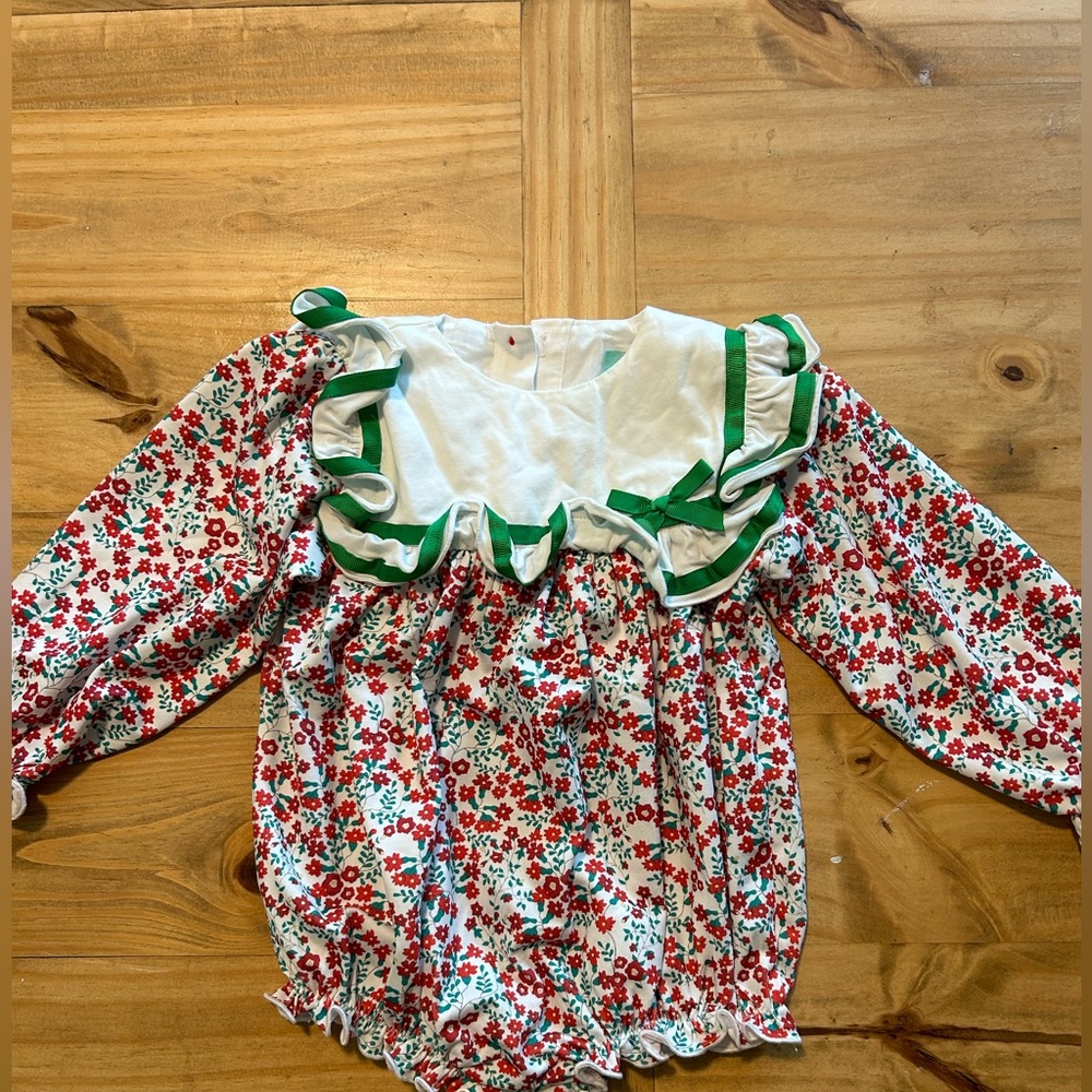 The Smocked Flamingo Christmas bubble! Runs big! 6-9 month, worn once for mass